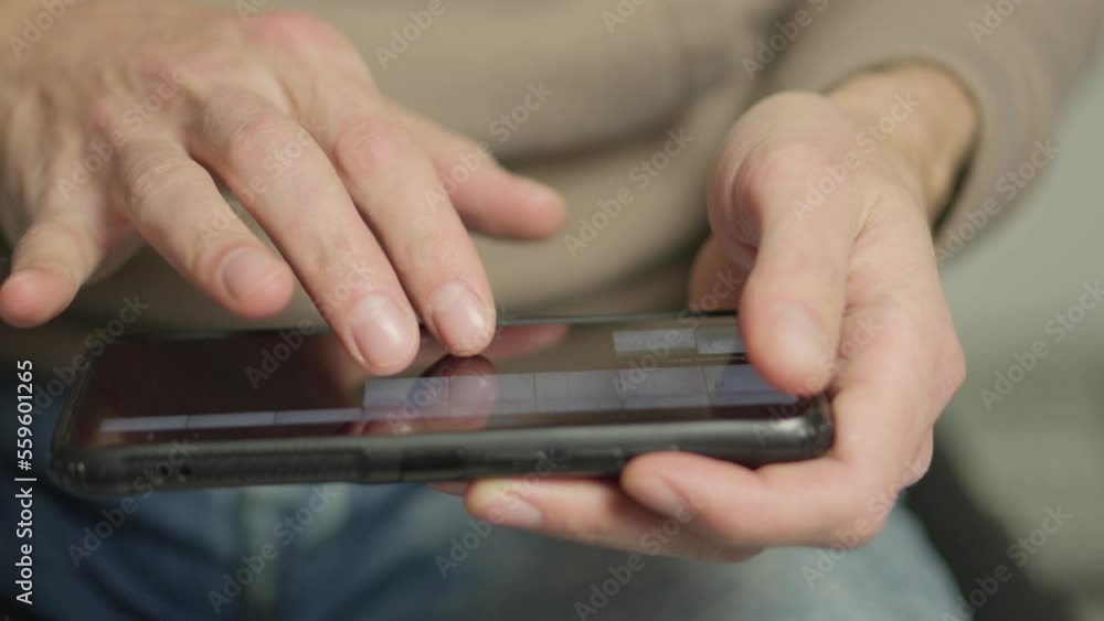Poster a man's finger touches a monitor to scroll a page on a mobile phone. viewing photos and documents in