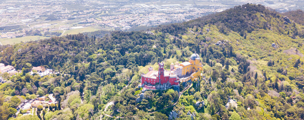 Picturesque Sintra Mountains landscape in sunny spring day with Romanticist castle of Pena Palace,...