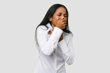 Young Indian woman cut out isolated on white background suffers pain in throat due a virus or infection.