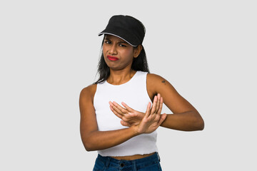 Young Indian woman cut out isolated on white background doing a denial gesture