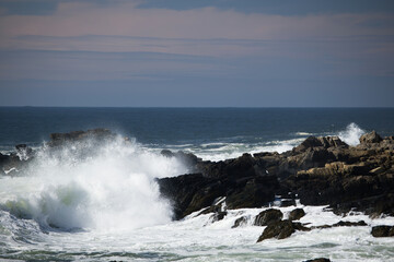 Ocean waves crashing against a rocky shore
