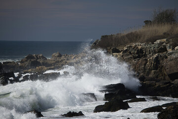 Ocean waves crashing against a rocky shore