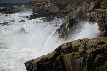 Ocean waves crashing against a rocky shore