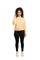 Young african american woman with curly hair cut out isolated cheerful and confident showing ok...