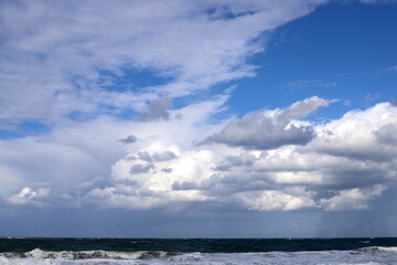 Naklejka na ściany i meble Rain clouds in the sky over the Mediterranean Sea in northern Israel.