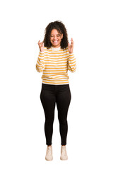 Young african american woman with curly hair cut out isolated joyful laughing a lot. Happiness concept.