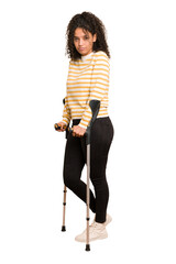 Full body young african american woman with crutches isolated