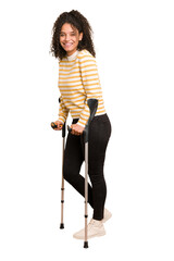 Full body young african american woman with crutches isolated