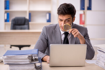 Young male employee working in the office