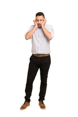 Fototapeta premium Full body adult latin man cut out isolated covering ears with hands.