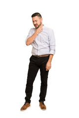 Fototapeta premium Full body adult latin man cut out isolated suffers pain in throat due a virus or infection.