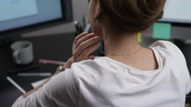 Young Asian business woman suffering from neck pain while working. Office syndrome concept.