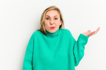 Young caucasian woman isolated on white background doubting and shrugging shoulders in questioning...