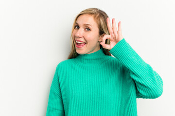 Young caucasian woman isolated on white background cheerful and confident showing ok gesture.