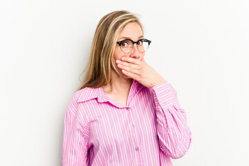 Young caucasian woman isolated on white background covering mouth with hands looking worried.