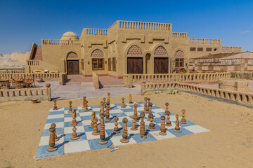 Abandoned mud brick hotel witch a chess board in Al Qasr village in Dakhla oasis, Egypt