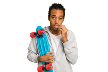 Young skater African American man isolated biting fingernails, nervous and very anxious.