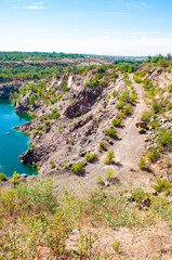Fototapeta na wymiar Landscape overlooking a stone quarry filled with water