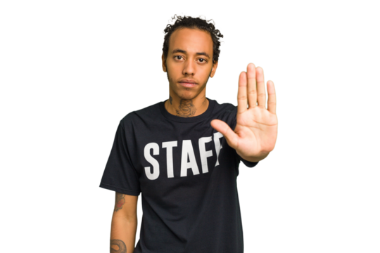 Young African American staff man isolated standing with outstretched hand showing stop sign, preventing you.