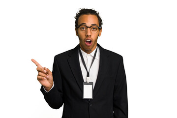 Young African American business man with badge isolated pointing to the side