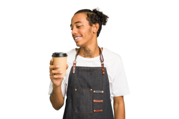 Young African American waiter man holding a takeaway coffee isolated looks aside smiling, cheerful and pleasant.