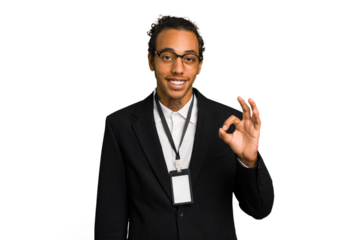 Young African American business man with badge isolated cheerful and confident showing ok gesture.
