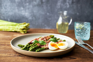 Grilled asparagus with bacon and egg benedict for breakfast or lunch. healthy eating