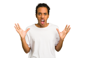 Young African American man isolated screaming to the sky, looking up, frustrated.