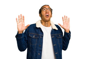 Young African American man isolated screaming to the sky, looking up, frustrated.