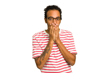 Young African American man isolated shocked, covering mouth with hands, anxious to discover something new.