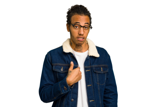 Young African American man isolated surprised pointing with finger, smiling broadly.