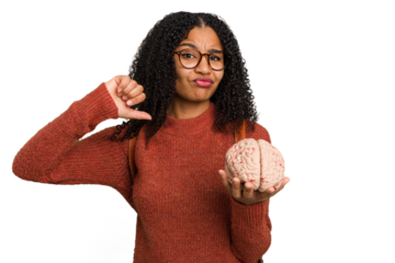Young student african american woman holding a brain isolated feels proud and self confident, example to follow.