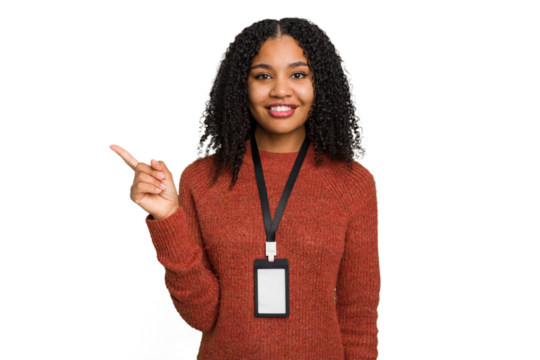 Young african american woman with ID card isolated smiling and pointing aside, showing something at blank space.