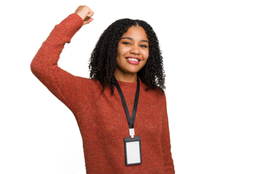 Young african american woman with ID card isolated raising fist after a victory, winner concept.