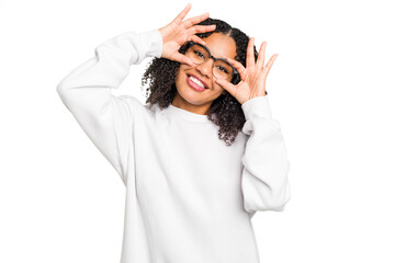 Young african american woman with curly hair cut out isolated showing okay sign over eyes