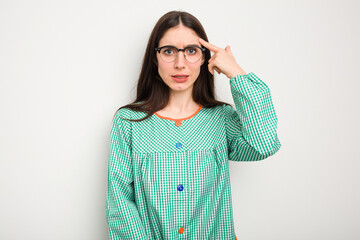 Young caucasian child education teacher isolated on white background showing a disappointment gesture with forefinger.