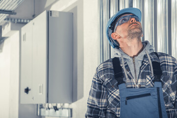 HVAC Technician Checking Air Ducts During Scheduled Maintenance