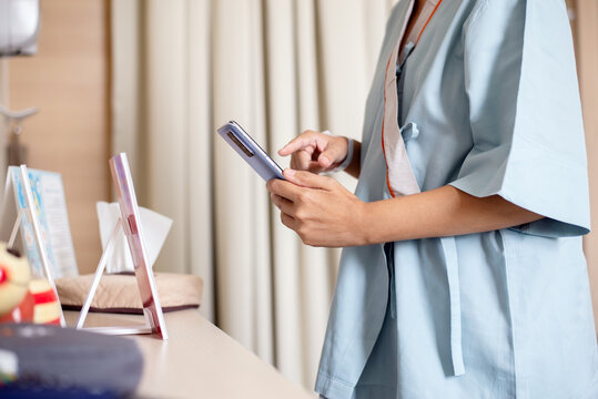 Patient woman using smartphone scan qr codes to connect a doctor to health Information