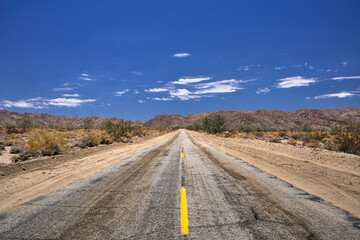 Desert road and cloudy sky in the Joshua Tree National Park