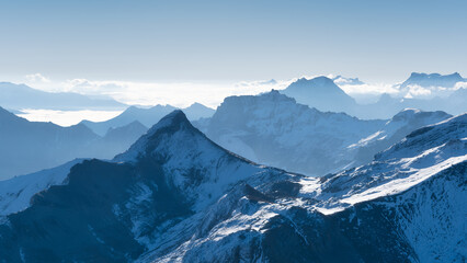 Mountain scenery in the Swiss Alps. Mountains peaks. Natural landscape. Mountain range and clear blue sky. Landscape in the summertime. Large resolution photo.