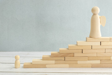 A wooden human figure has witnessed the transformation and change of another person.