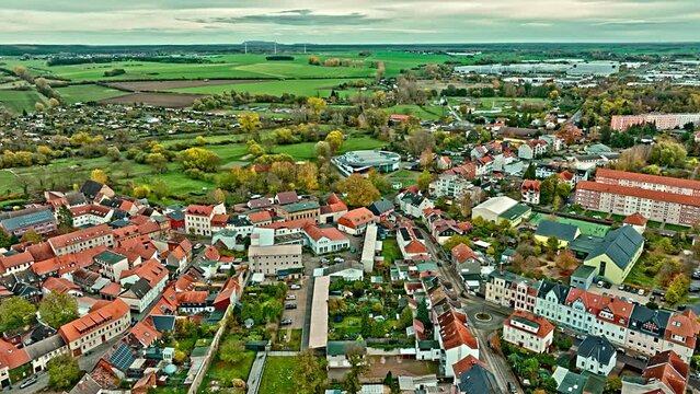 Aerial View Of a neighborhood in Haldensleben town, Saxony-Anhalt, Germany . Flying over houses and trees .