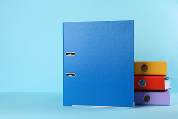 Hardcover office folders on light blue background