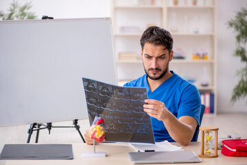 Young male doctor radiologist working in the clinic