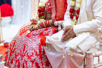 Fototapeta na wymiar Indian Hindu wedding rituals bride and groom's hands close up