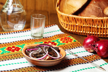 marinated mushrooms with spices and red onion.