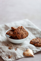 Homemade cookies with cereal and seeds, bowl on a table, made with love