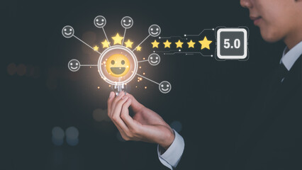 customer service and satisfaction concept,service satisfaction,very impressive rating,Evaluation and Audit,Businessman holding light bulb and 5 stars icon representing top quality in good and services