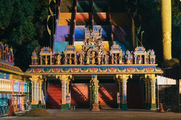 Fototapeta premium Entrance of the Batu caves temple in the earning morning with street light only.