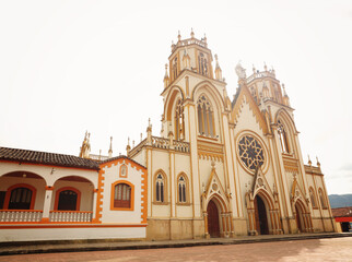 Fototapeta na wymiar Colombia. The main plaza houses and church. Cathedral in Boyaca, Colombia.